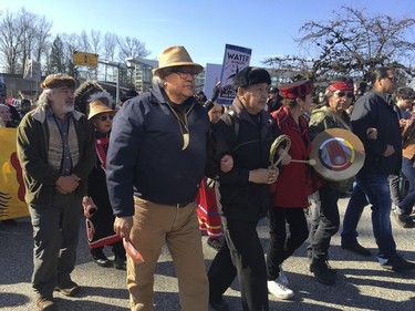 Protesters rally against a  pipeline expansion in Burnaby, British Columbia, Canada, Saturday, March 10, 2018. The protesters are calling on people to raise their voices Saturday to stop a $5.7 billion pipeline ($7.4 billion Canadian) expansion project that pumps oil from Canada's tar sands to the Pacific Coast.  ( AP Photo/Phoung Lee) ORG XMIT: RPPL603