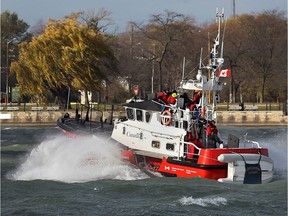 The Canadian Coast Guard Cape Dundas search-and-rescue lifeboat chops through the Detroit River near Windsor, Ont., on Nov. 19, 2015, on a blustery day.