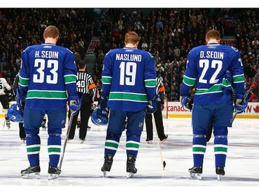 November 27, 2007:  Daniel Sedin #22, Markus Naslund #19 and Henrik Sedin #33 of the Vancouver Canucks listen to the national anthems before their game against the Anaheim Ducks at General Motors Place. The Canucks won 4-0.