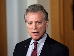 Minister of Environment and Climate Change Strategy George Heyman answers questions about the Alberta dispute during a press conference at the Legislature in Victoria, B.C., on Wednesday February 7, 2018.