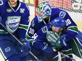 Comets goalie Thatcher Demko catches teammate Jonathan Dahlen as he skates into the net during the North Division semifinals playoff game against Toronto on Friday, April 27, 2018, at the Adirondack Bank Center at the Utica Memorial Auditorium.