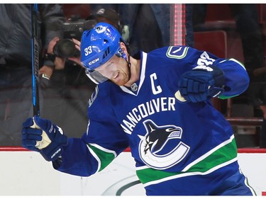 OCTOBER 18: Henrik Sedin #33 of the Vancouver Canucks celebrates the overtime winning goal against the St. Louis Blues during their NHL game at Rogers Arena. Vancouver won 2-1 in overtime.