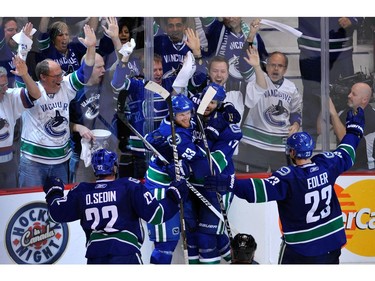 MAY 15:  Henrik Sedin #33 of the Vancouver Canucks celebrates with teammates after his third period goal against the San Jose Sharks in Game One of the Western Conference Finals during the 2011 Stanley Cup Playoffs at Rogers Arena