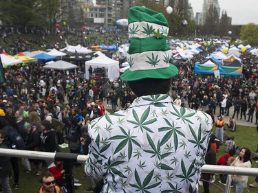 "Landlord," wearing a marijuana leaf motif jacket, looks over the crowds gathered at Sunset Beach for the annual 4/20 protest in Vancouver.