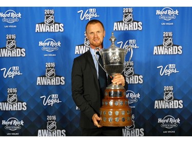 LAS VEGAS, NV - JUNE 22:  Henrik Sedin poses after winning the King Clancy Memorial Trophy for leadership on and off the ice and noteworthy humanitarian contribution to community at the 2016 NHL Awards at the Hard Rock Hotel .