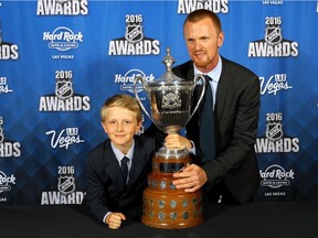 Henrik Sedin and son Valter pose after Henrik wins the King Clancy Memorial Trophy for leadership on and off the ice and noteworthy humanitarian contribution to community at the 2016 NHL Awards at the Hard Rock Hotel & Casino on June 22, 2016 in Las Vegas, Nevada.