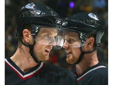 Nov. 19, 2006:  Daniel  (L)  and twin brother Henrik skate by each other during their game against the Chicago Blackhawks at GM Place.