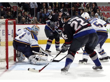 March 15, 2007:   Daniel a pass from his brother Henrik as he prepares to shoot the puck past goaltender Curtis Sanford #1 of the St. Louis Blues for the overtime winning goal as Barret Jackman #5 of the Blues looks on.