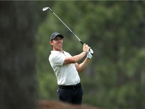 Rory McIlroy of Northern Ireland plays his second shot on the 17th hole during the second round of the 2018 Masters Tournament.