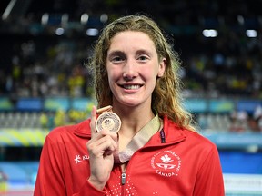 Teenage swimmer Taylor Ruck won bronze in the women's 100-metre freestyle Monday at the Commonwealth Games, tying a 52-year-old Canadian record with her seventh medal of the games.