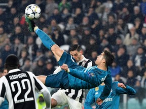 Real Madrid forward Cristiano Ronaldo overhead kicks and scores during the UEFA Champions League quarter-final, first-leg match against Real Madrid at the Allianz Stadium in Turin, Italy, on April 3.