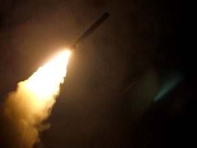 The guided-missile cruiser USS Monterey fires a Tomahawk land attack missile on April 14, 2018.  The United States, Britain and France carried out a wave of pre-dawn strikes against Syria's regime Saturday in response to a suspected chemical weapons attack, lighting up the sky of Damascus as explosions shook the city.