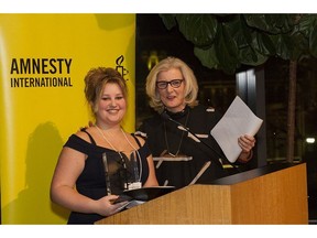 B.C. student Ashley Hyshka receives the Amnesty International Youth Media Award from MC Gillian Findlay. Photo: Danillo Ursini  [PNG Merlin Archive]