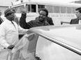 In this May 2, 1969 file photo, Rev. Ralph David Abernathy gives the victory sign as he is escorted back to jail from Charleston County Court in Charleston, S.C., wear he and others were taken for hearings on violating an injunction limiting pickets at two hospitals. The members of King's tight circle barely paused to grieve, after Martin Luther King Jr. was assassinated. They plunged into carrying out his unfinished work and turned it into a lifelong vow.