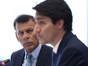 Canadian Labour Congress president Hassan Yussuff looks on as Prime Minister Justin Trudeau speaks at a conference in Ottawa.