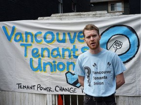 Liam McClure, an advocate with the Vancouver Tenants Union, speaks at a Saturday rally outside apartments at 533 Woodland Dr. and 1552 East Pender St. which are slated for renovation and whose tenants face eviction.