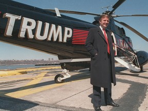 In this March 1988, file photo, Donald Trump stands next to a helicopter at New York Port Authority's West 30 Street Heliport.