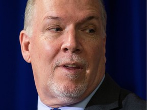 British Columbia Premier John Horgan listens during a housing announcement in Coquitlam, B.C., on Friday April 13, 2018.