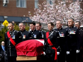 Pallbearers carry the casket of Victoria Police Const. Ian Jordan during a funeral service at Christ Church Cathedral in Victoria, B.C., on Thursday April 19, 2018. Jordan recently passed away while in a coma for 30 years after his police cruiser crashed into another police vehicle en route to the same emergency.