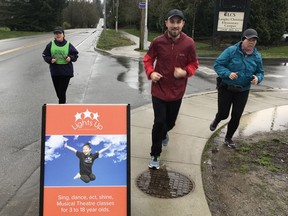 Sandra Jongs Sayer, left, the coordinator of the W.C. Blair Sun Run InTraining Clinic in Langley, keeps an eye on Jarod McIntosh and Teri Murao, as they train for the 34th annual Vancouver Sun Run on April 22. It will be McIntosh's first Sun Run.