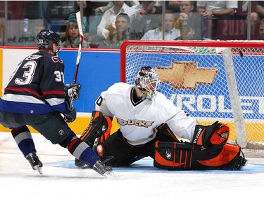 Sept. 24, 2006:   Henrik  scores on Ilya Bryzgalov #30 of the Anaheim Ducks during the overtime shootout at General Motors Place during their pre-season game. Vancouver defeated Anaheim 4-3.