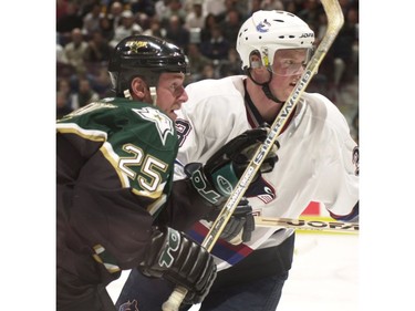 Feb. 28, 2001--  Dallas Stars Joe Nieuwendyk is shadowed by Vancouver Canucks Henrik Sedin.