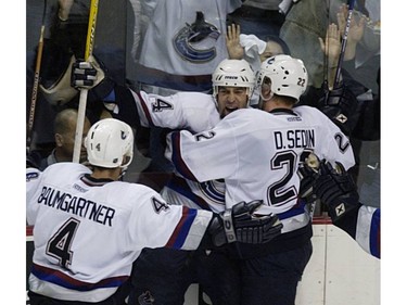 May 8, 2003: Todd Bertuzzi celebrates his goal with Daniel Sedin, and Nolan Baumgartner, for Canucks 2nd goal during 2nd period of NHL round 2 , game 7 playoff action at GM Place in Vancouver.