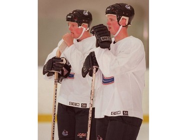 July 7, 2000: L-R Daniel and Henrik Sedin  watch the action during an on ice session at the Twist training camp.