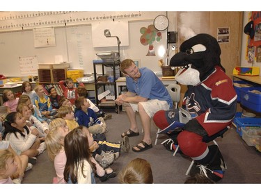 Sept 14, 2005: Vancouver Canuck Daniel Sedin, along with mascot Fin, took some time out of training camp to read to Myrtle Philip Grade one students Wednesday.