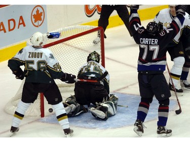 Oct. 16, 2005: Vancouver Canucks versus the Dallas Stars at GM Place. Pictured is Canucks' Anson Carter raising his hands after linemate Daniel Sedin's goal during the first period.