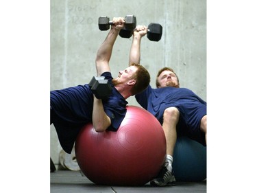 Sept. 17, 2006: Daniel, front, lifts some weights with his brother Henrik Sedin during some off ice training in Vernon.