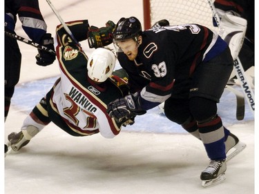 Nov 2-2005:  Henrik Sedin hauls down  Minnesota Wild Kyle Wanvig. Sedin got two minutes.