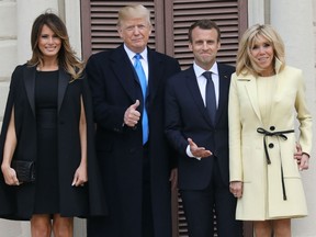 US first lady Melania Trump, husband US President Donald Trump, French President Emmanuel Macron and his wife first lady Brigitte Macron pose at Mount Vernon, the estate of the first US President George Washington, in Mount Vernon, Virginia, April 23, 2018.