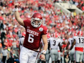 University of Oklahoma Sooners quarterback Baker Mayfield (above) celebrates after running back Rodney Anderson scored a touchdown against Georgia during the Rose Bowl game in Pasadena, Calif., on Jan. 1, 2018. Mayfield was picked first overall by the Cleveland Browns in the NFL Draft on April 26, 2018.