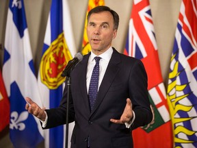 Federal Finance Minister Bill Morneau updates the media on the talks involving the plans for Trans Mountain pipeline extension during a briefing in Toronto on Tuesday, April, 11, 2018.