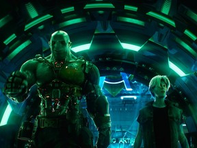 This cover image released by Warner Bros. Pictures shows characters Aech, left, and Parzival in a scene from "Ready Player One," a film by Steven Spielberg.