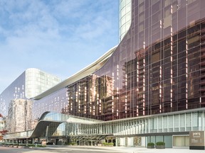 The Parq Vancouver  features two high-end hotels — the DOUGLAS on the left, the JW Marriott Parq Vancouver on the right — and a two-level casino with floor-to-ceiling windows in the middle.