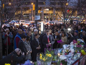 Toronto Mayor John Tory joins mourners gather for a vigil organized by the Korean Canadian Cultural Association in Toronto on Friday, April 27, 2018.