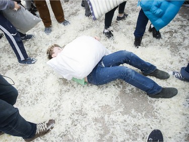 Liam Broomfeld, aplays possum before rejoining the pillow fight on the Robson street plaza side of the Vancouver art Gallery to celebrate International Pillow Fight Day, Vancouver, April 07 2018.