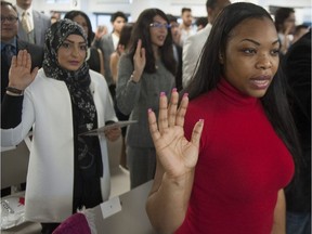 The unusually candid Immigration Department report skewers the Status of Women’s office for making the “distorted” claim that immigrant women are “marginalized” in Canada and for incorrectly stating that Muslim women are prime victims of Canadian hate crimes. (Photo: Women take the oath of citizenship in Vancouver in 2017.)