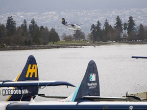 A Harbour Air seaplane lands at in Vancouver Wednesday. Harbour Air and Seattle’s Kenmore Air plan to launch 20 flights a week between Vancouver's Coal Harbour and Seattle’s Lake Union on April 26.