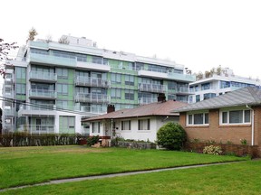 Houses on Manson St in Vancouver with the low rise building on 41st in the background.