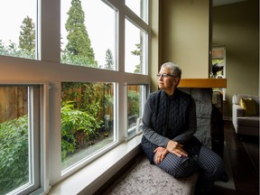 Simin Tabrizi sits in the common room and looks out to where a proposed development at 4575 Granville St. would be next to the Vancouver Hospice on April 16.