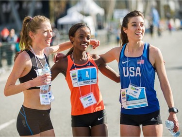 Top three women's finishers, from left, Rachel Cliff (3rd), Monicah Ngige (1st) and Emma Bates (2nd) .