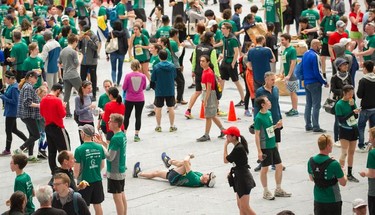 A runner stretches on the floor after the race.