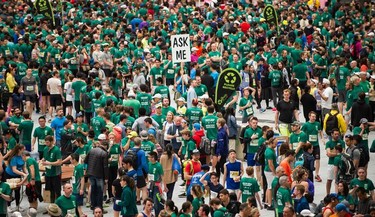 A volunteer waits for questions during the Vancouver Sun Run in Vancouver, BC, April 22, 2018.