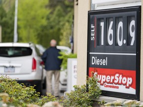 A motorist fills up his car at 160.9 cents a litre, the posted price for regular gas in Surrey.