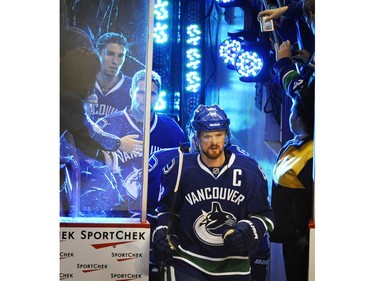 MAY 07, 2011: #33 Henrik Sedin leads his team on to the ice versus the Nashville Predators before the first period of Game Five of the Western Conference Semifinals during the 2011 NHL Stanley Cup Playoffs at Rogers Arena.