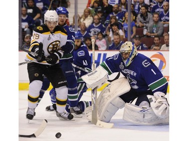 JUNE 11, 2011 --  Henrik Sedin of the Vancouver Canucks stops Tyler Seguin of the Boston Bruins from taking a shot on goalie Roberto Luongo during the second period of game five in the 2011 NHL Stanley Cup final in Vancouver