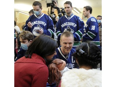 December 11, 2014 -- Vancouver Canucks' Henrik Sedin  meets with sick children at the BC Childrens Hospital in Vancouver.